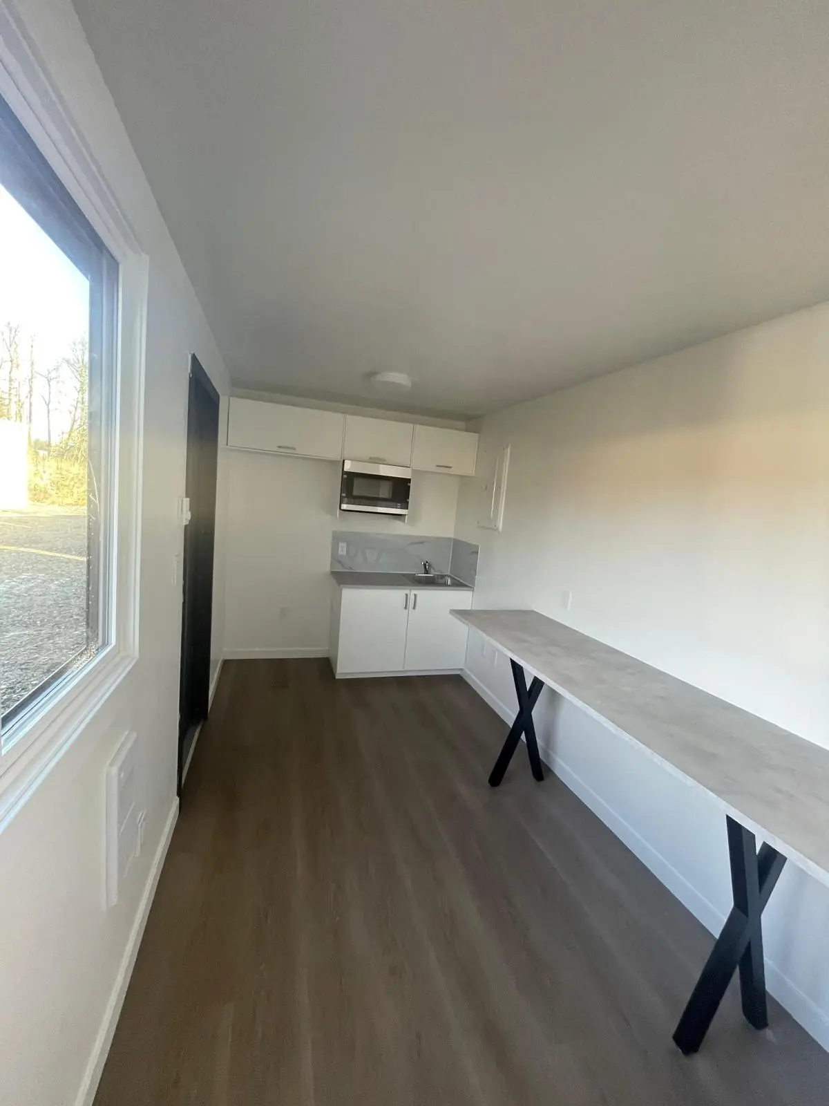 container lunchroom kitchenette with sink and cabinets